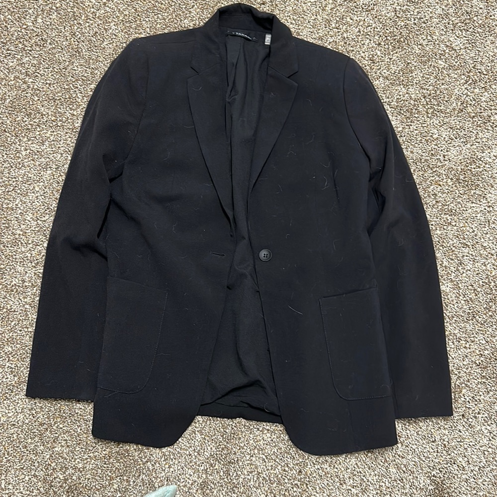 Women’s blazer. Never worn, material is great quality.
